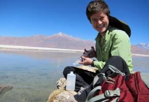 Markovich collecting isotope samples at a lake in the Atacama Desert of Chile