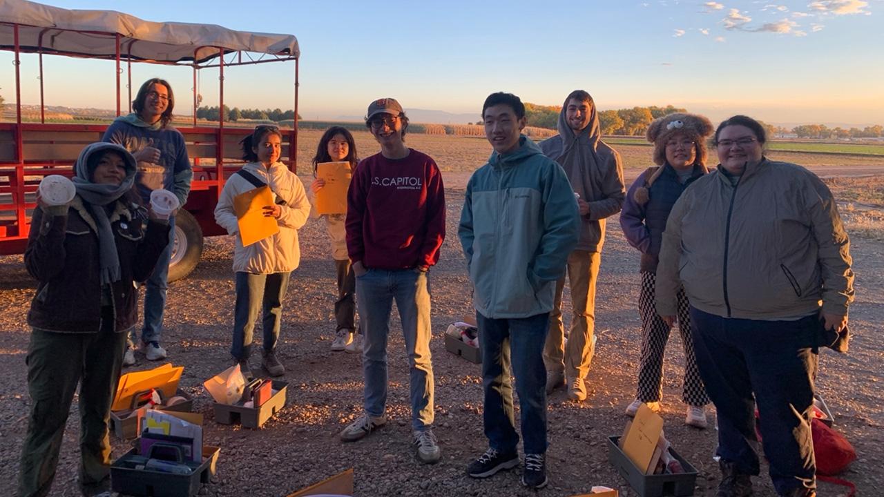 2024 UC Davis Collegiate Soil Judging Team at the New Mexico State University Agricultural Science Center bright and early preparing for a full day of soils action.